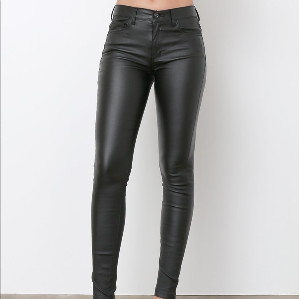 Sneak peek black shiny coated skinny jeans